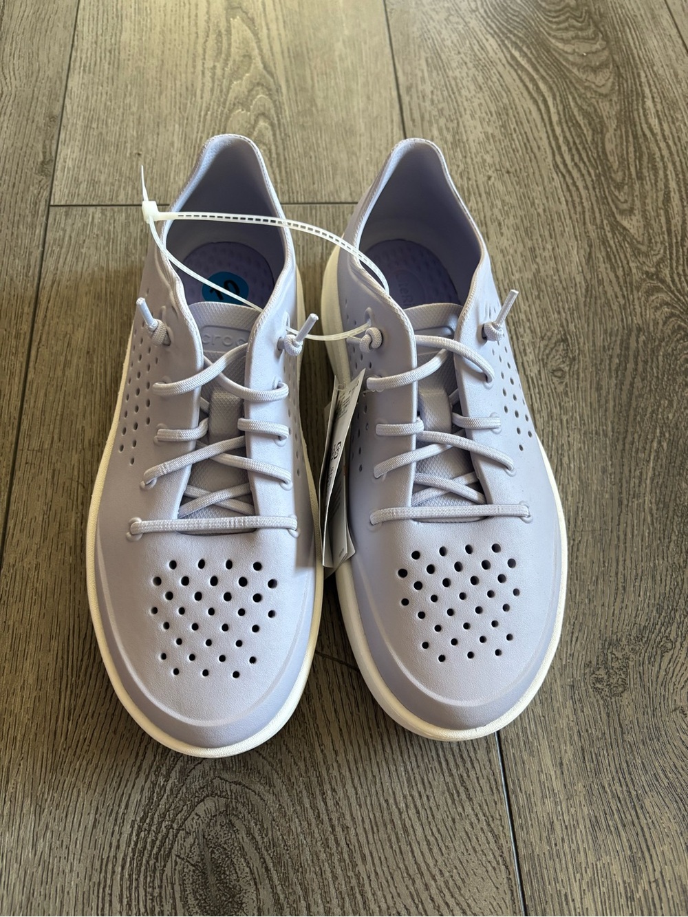Crocs woman’s  Casual Perforated Lace-Up Sneakers in Light Lavender